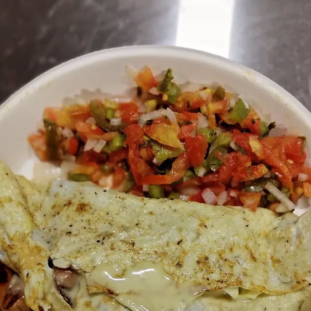 Chicken-sausage omelet with fresh salsa at QnQ Cafe Sainikpuri