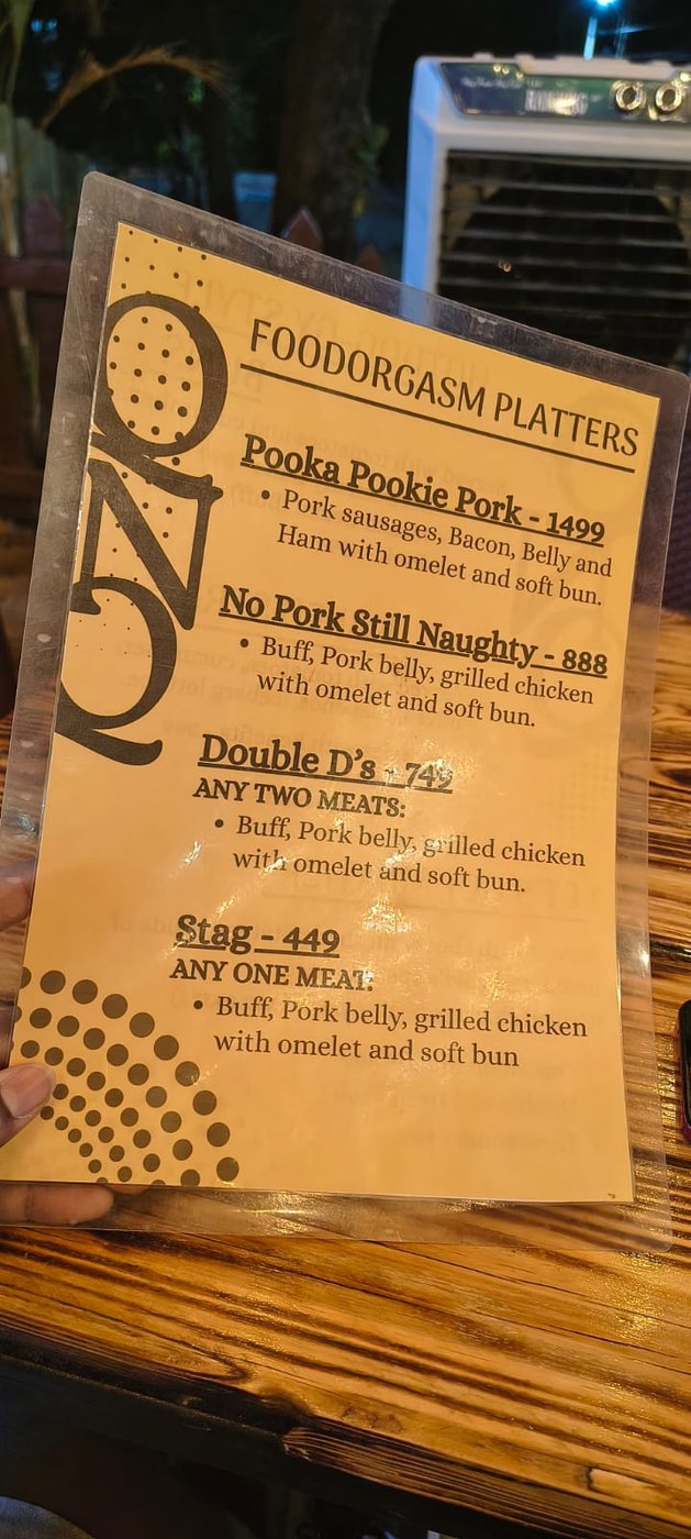 QnQ Cafe menu card — Foodorgasm Platters and Hotdog-gy Style Buns with prices