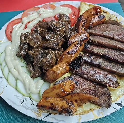 Threesome platter with three grilled meats and mash at QnQ Cafe Hyderabad